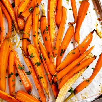 overhead view of roasted carrots on foil lined pan