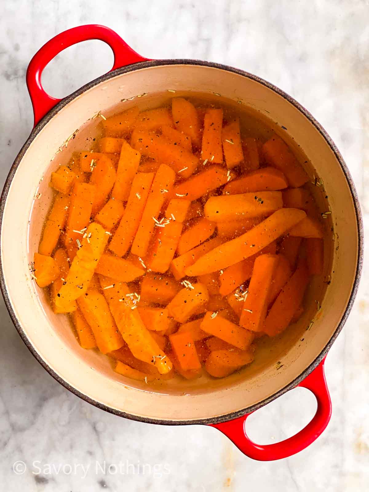 cut up sweet potatoes in pot of water