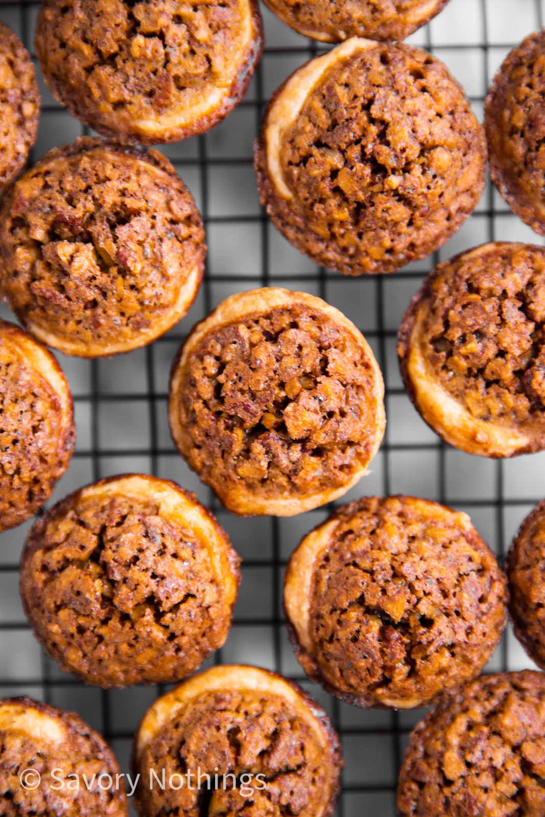 overhead view of pecan tassies on cooling rack