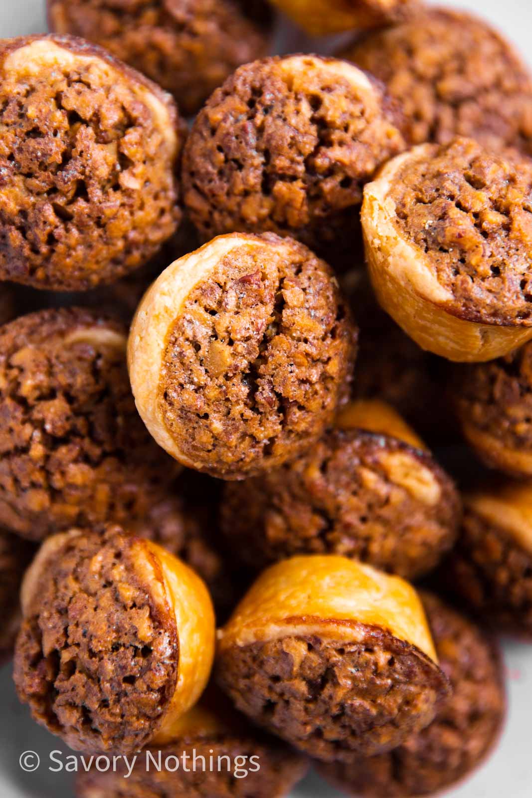 pile of pecan tassies on plate