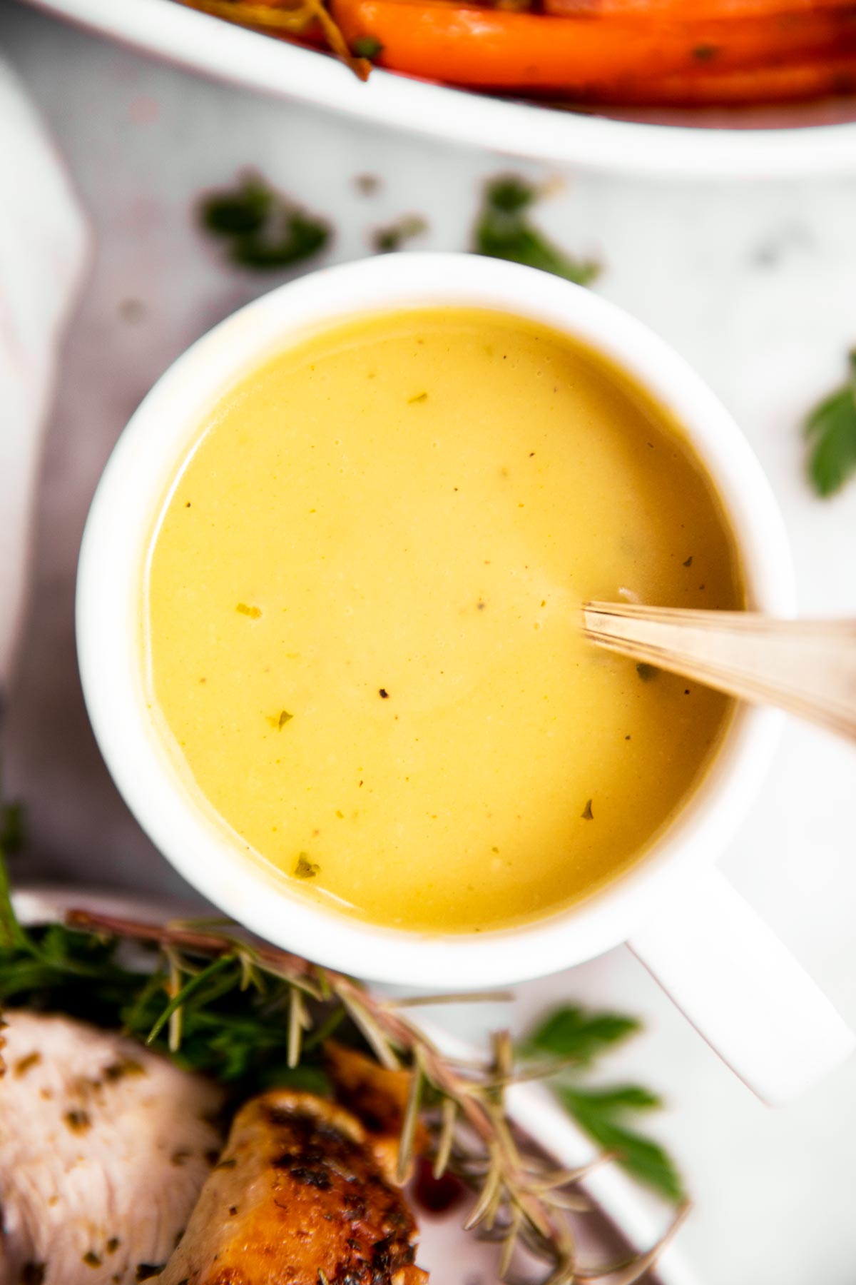 overhead view of mug filled with homemade turkey gravy