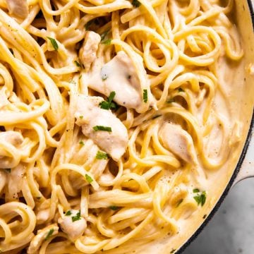 overhead view of chicken fettuccine alfredo in white pan