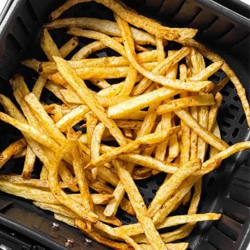 overhead view of french fries in air fryer basket