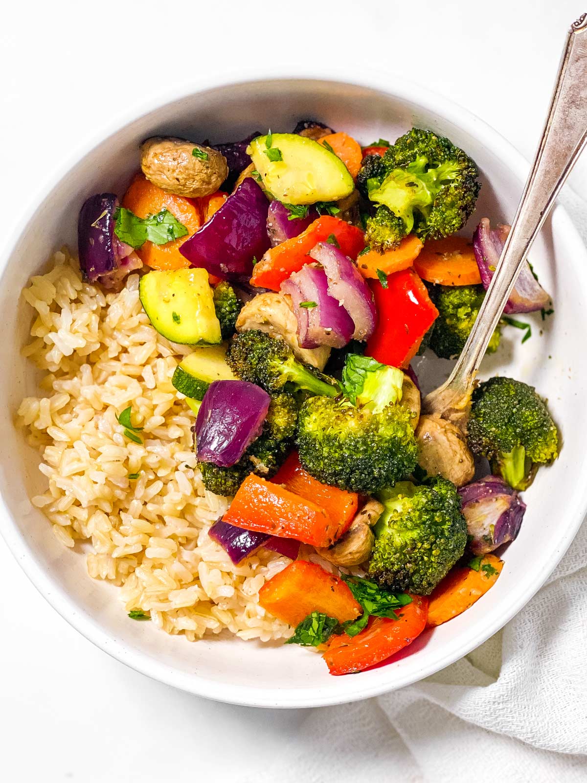 air fryer vegetables in white bowl with rice