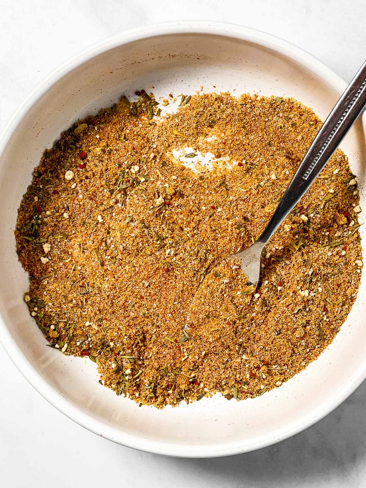 seasoning mix in white bowl with fork