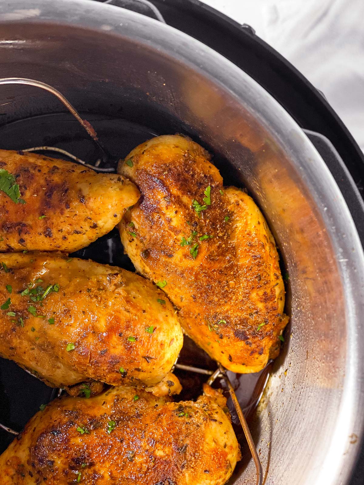 overhead view of chicken breast in instant pot