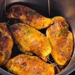 frontal view of five chicken breasts in instant pot