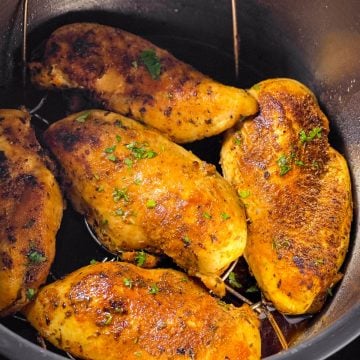 frontal view of five chicken breasts in instant pot