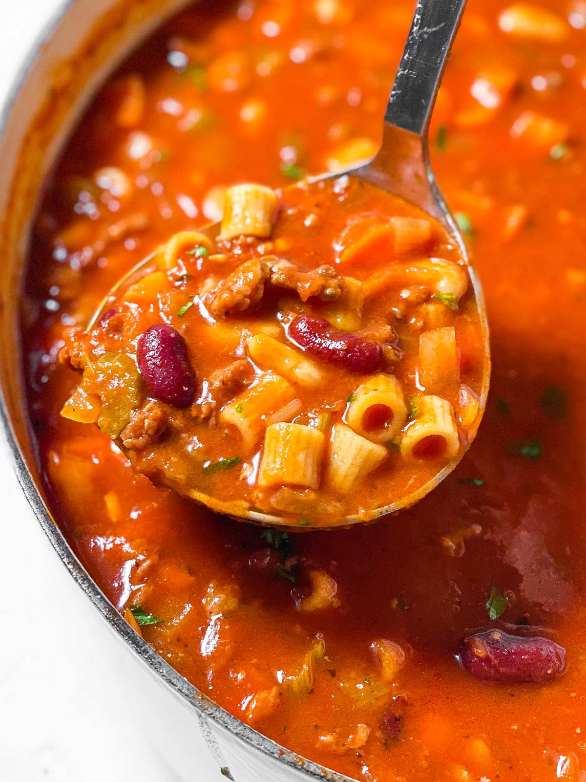 ladle with pasta fagioli soup