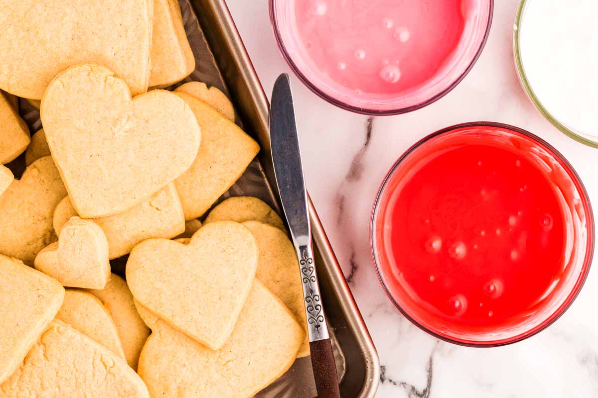 Icing heart shaped sugar cookies.