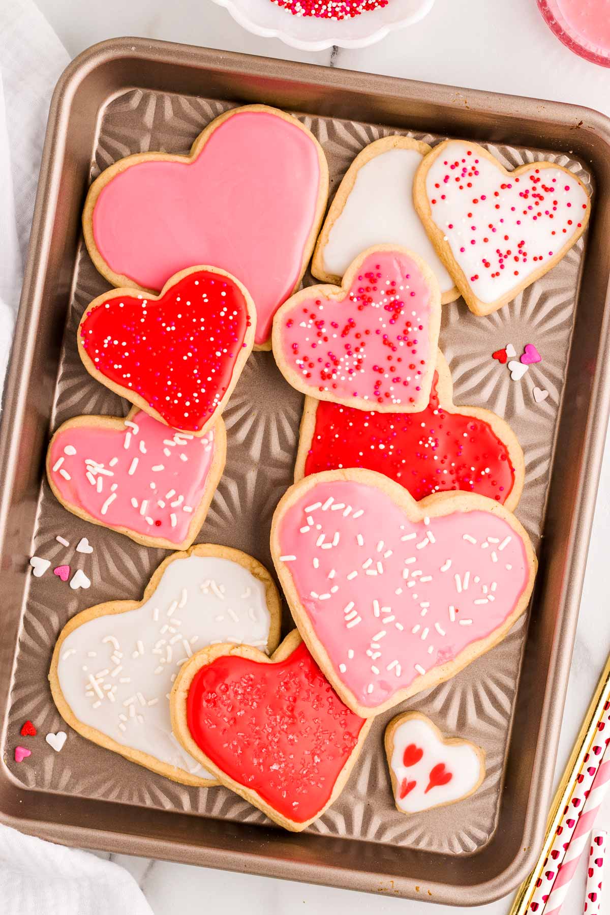 heart shaped sugar cookies on a cookie sheet.