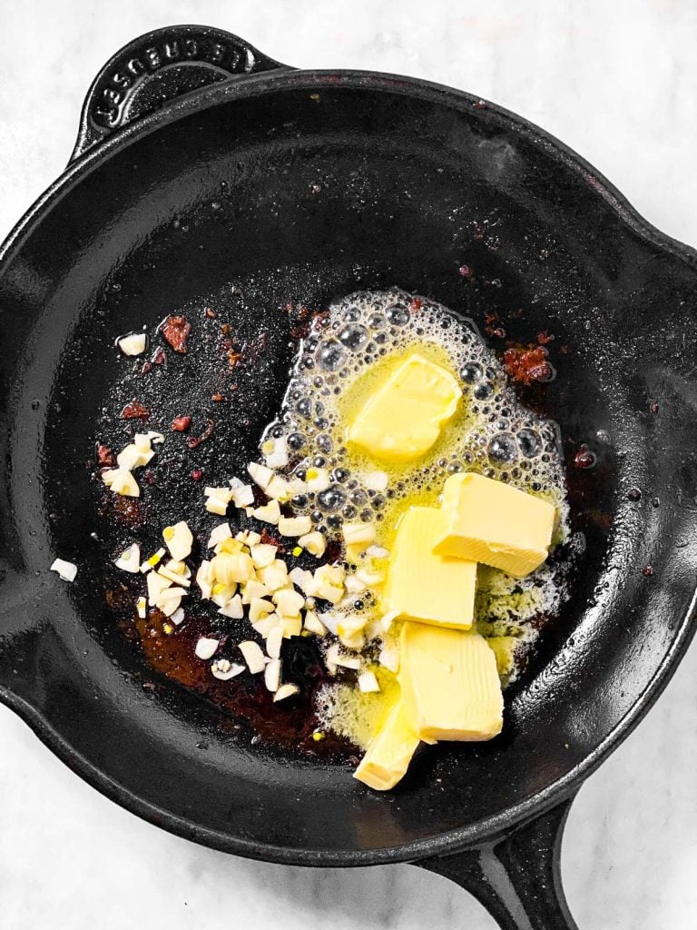 butter and garlic in cast iron skillet