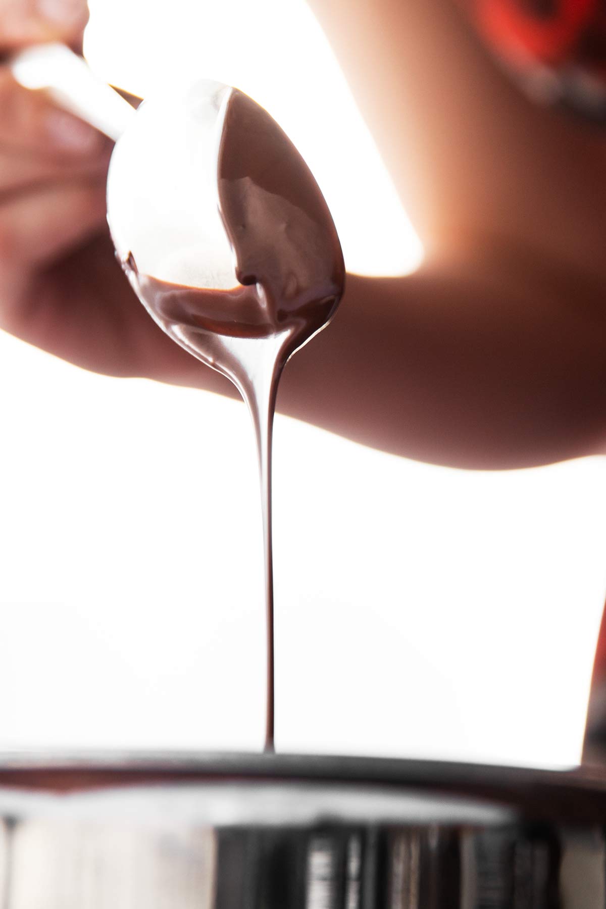 melted chocolate running off spoon