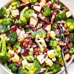 overhead closeup of broccoli salad in white bowl