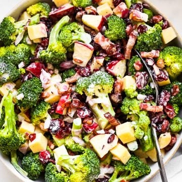 overhead closeup of broccoli salad in white bowl