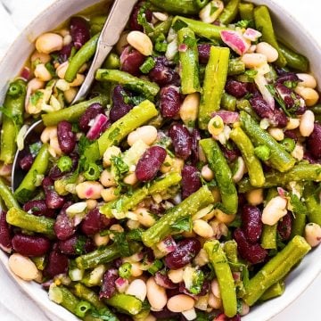 overhead view of three bean salad in white salad bowl