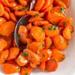 close up photo of glazed carrots with parsley