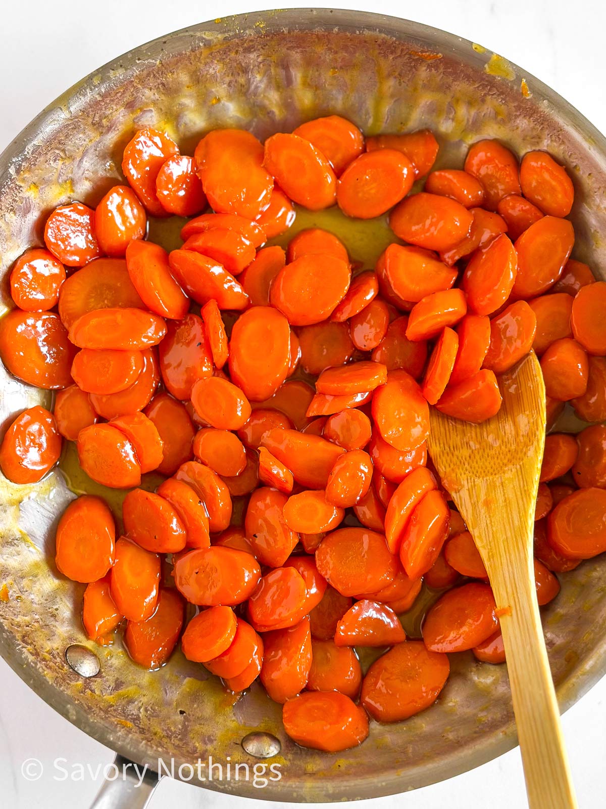 overhead view of glazed carrots in skillet