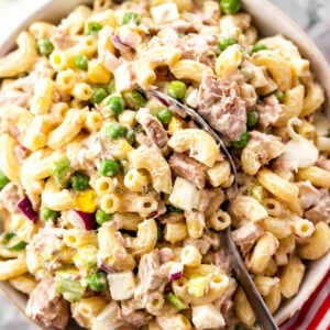 overhead view of tuna macaroni salad in white bowl