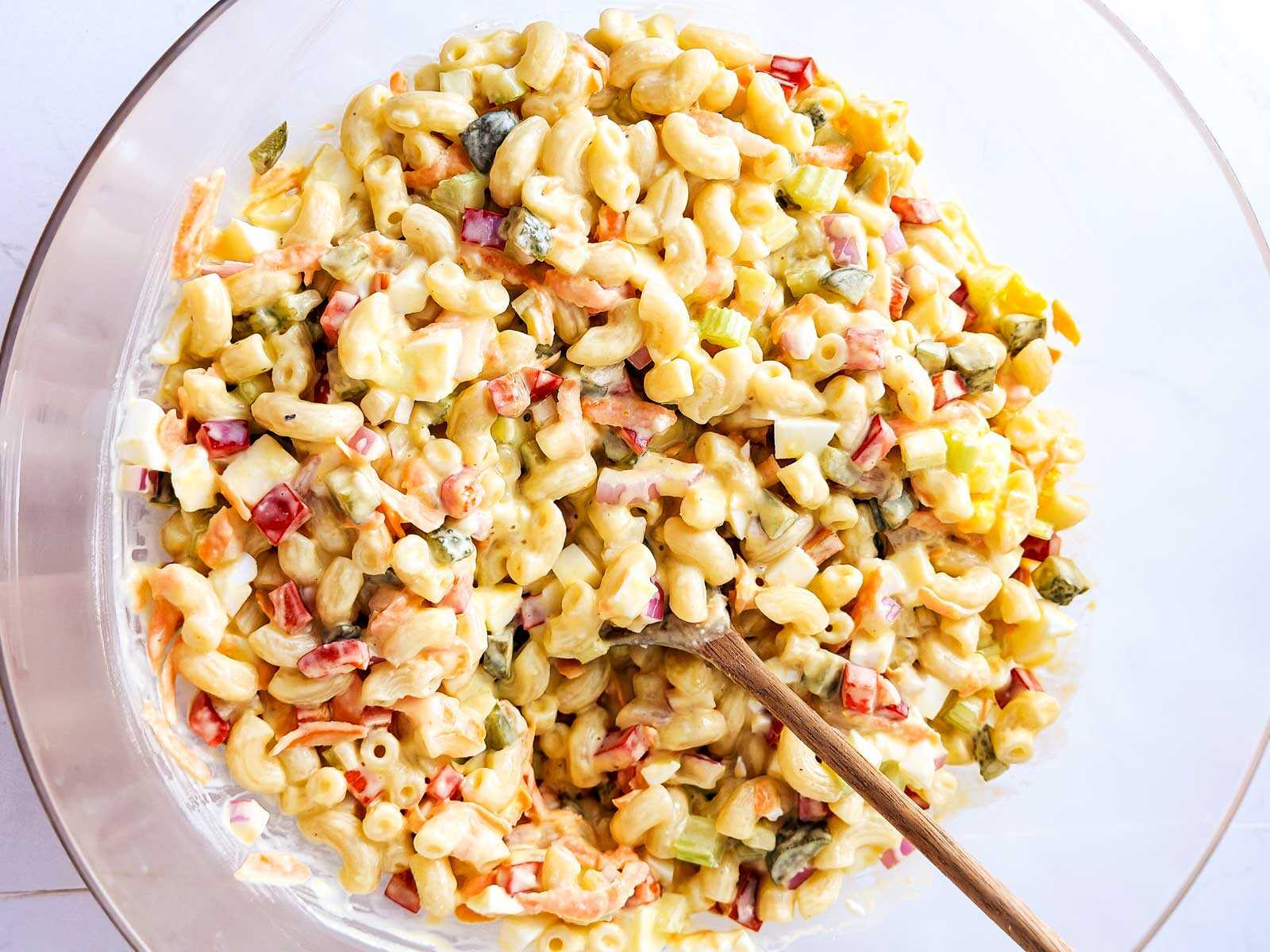 overhead view of macaroni salad in glass bowl