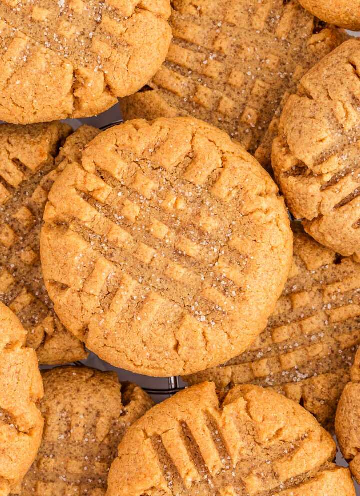 overhead close up view of piled peanut butter cookies
