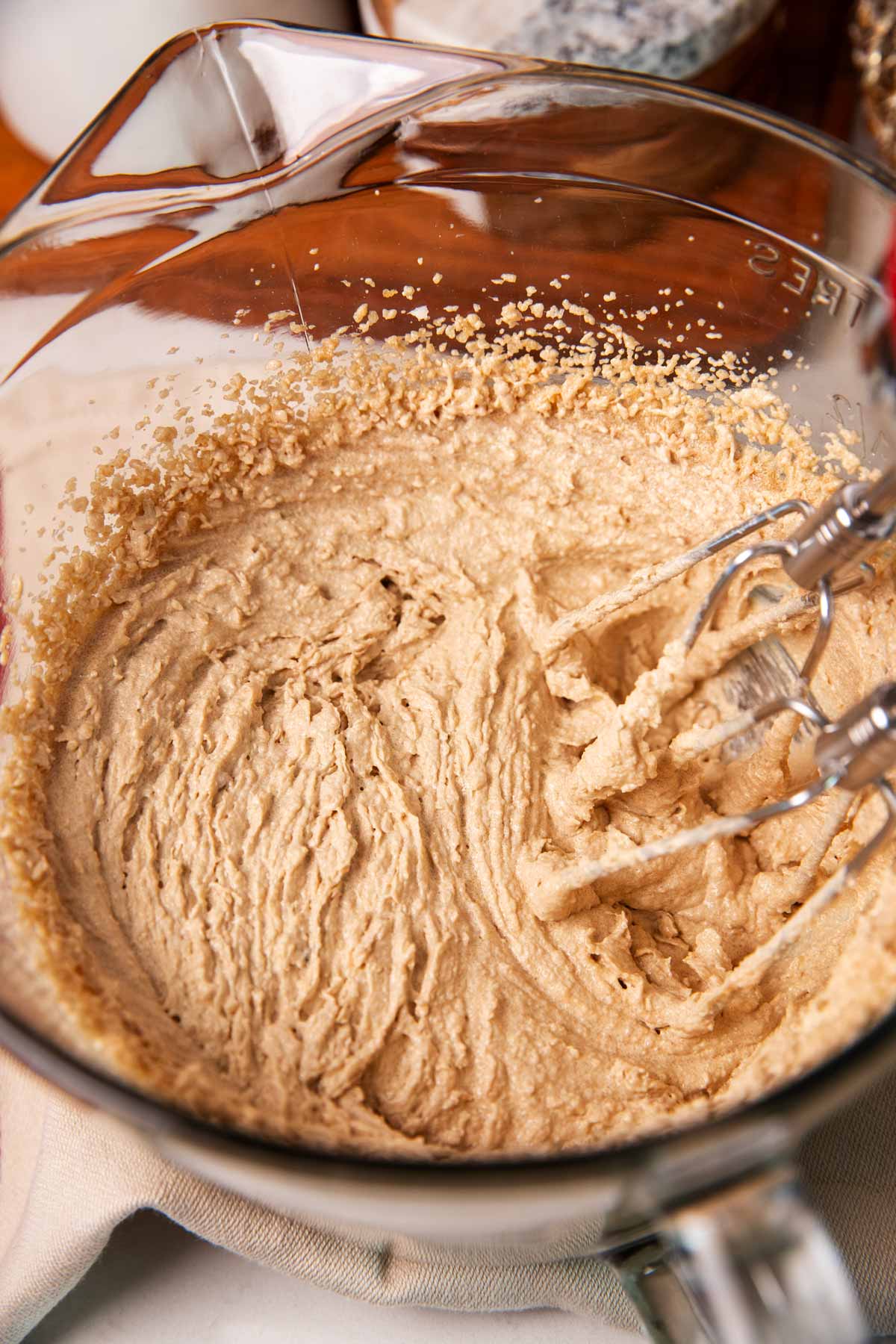 Creamed butter and sugar in a glass bowl.