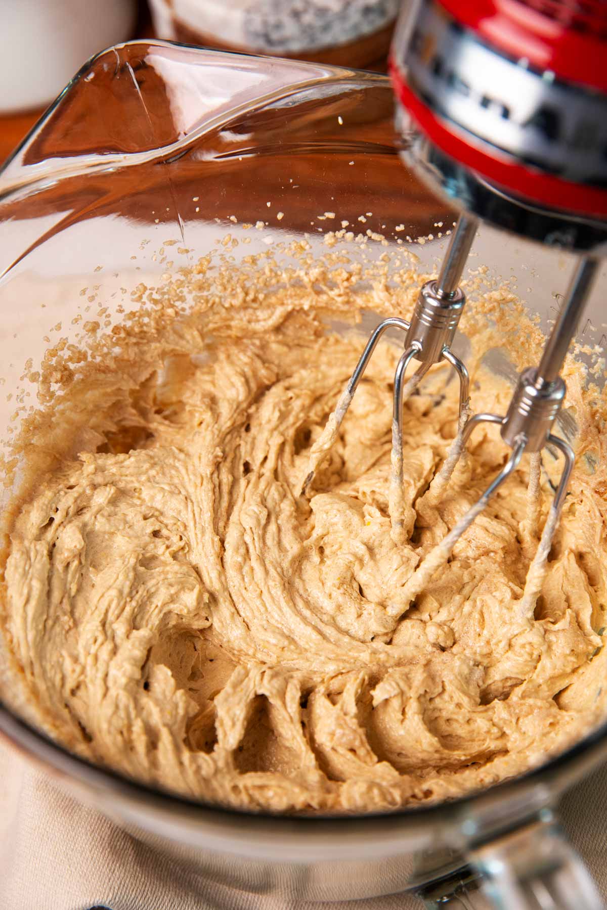 Creamed butter, sugar and eggs in a glass bowl.