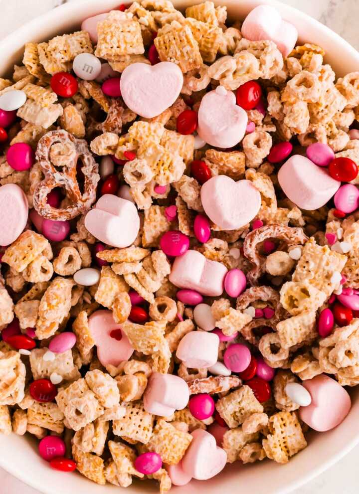 overhead view of valentine's treat mix in a white bowl