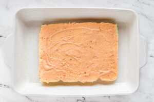 overhead view of halved slab of rolls spread with thousand island dressing