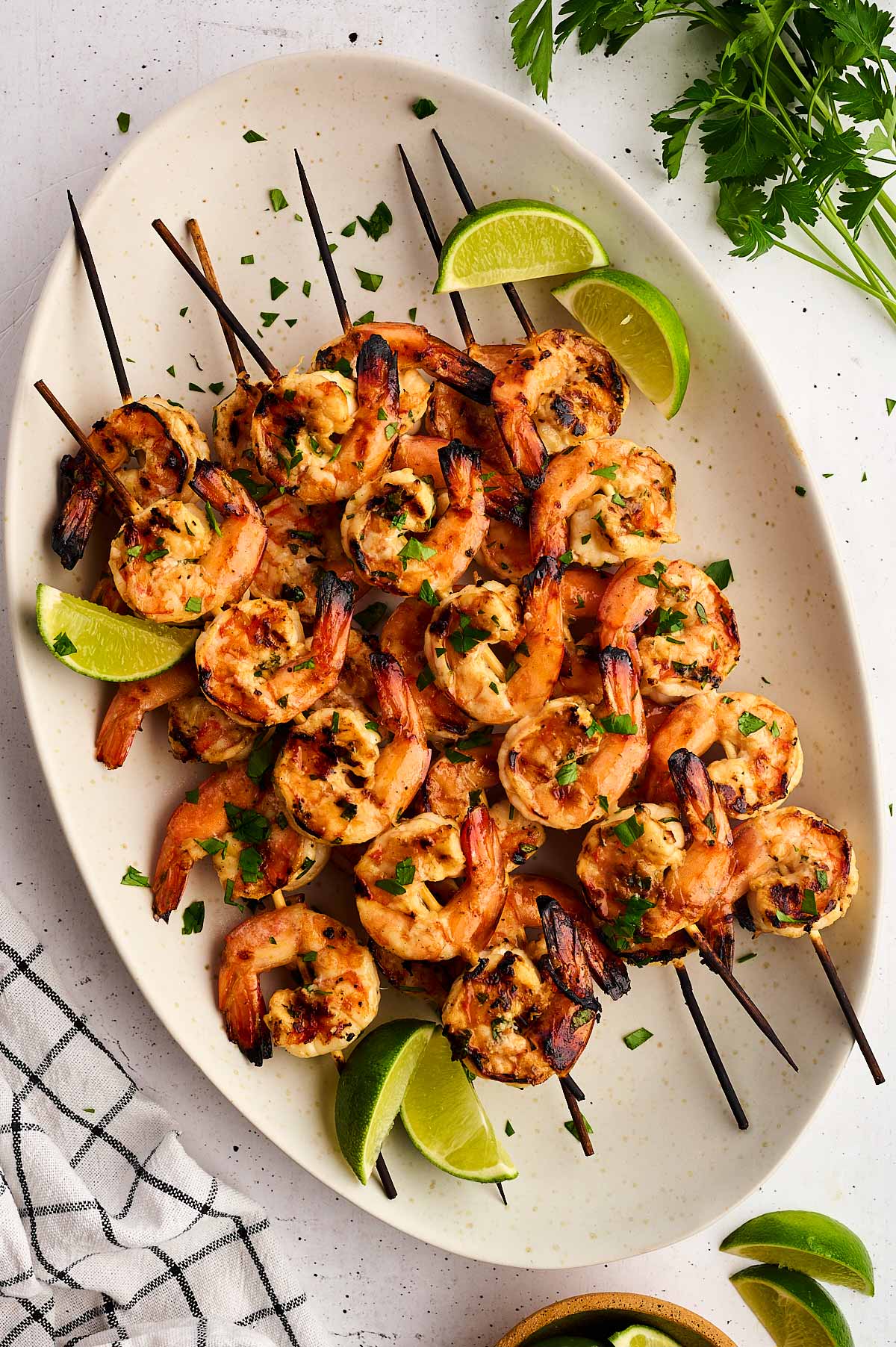 grilled shrimp skewers on platter