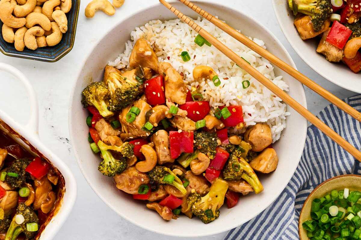 baked cashew chicken over rice in bowl