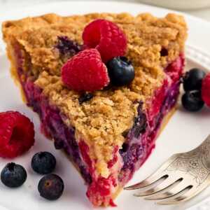 slice of berry custard pie on white plate