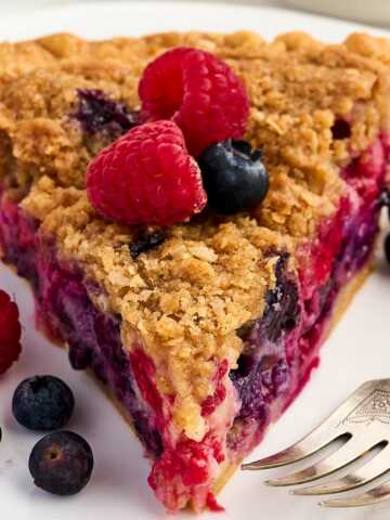 slice of berry custard pie on white plate