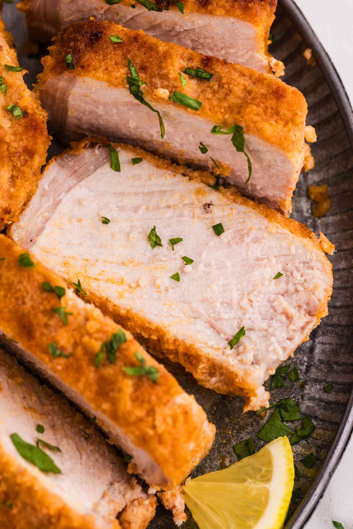 close up photo of sliced breaded pork chop