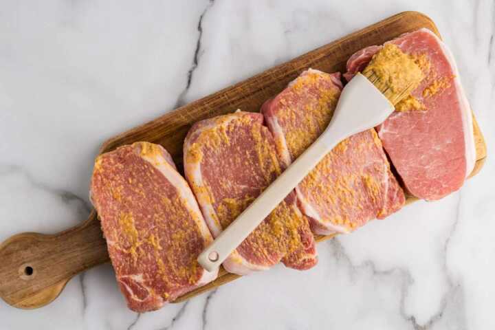 pork chops brushed with mustard
