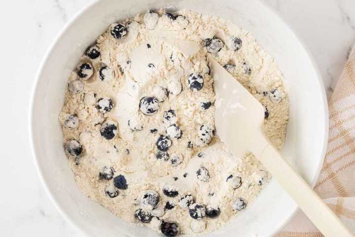 dry ingredients for sour cream blueberry muffins with blueberries tossed in