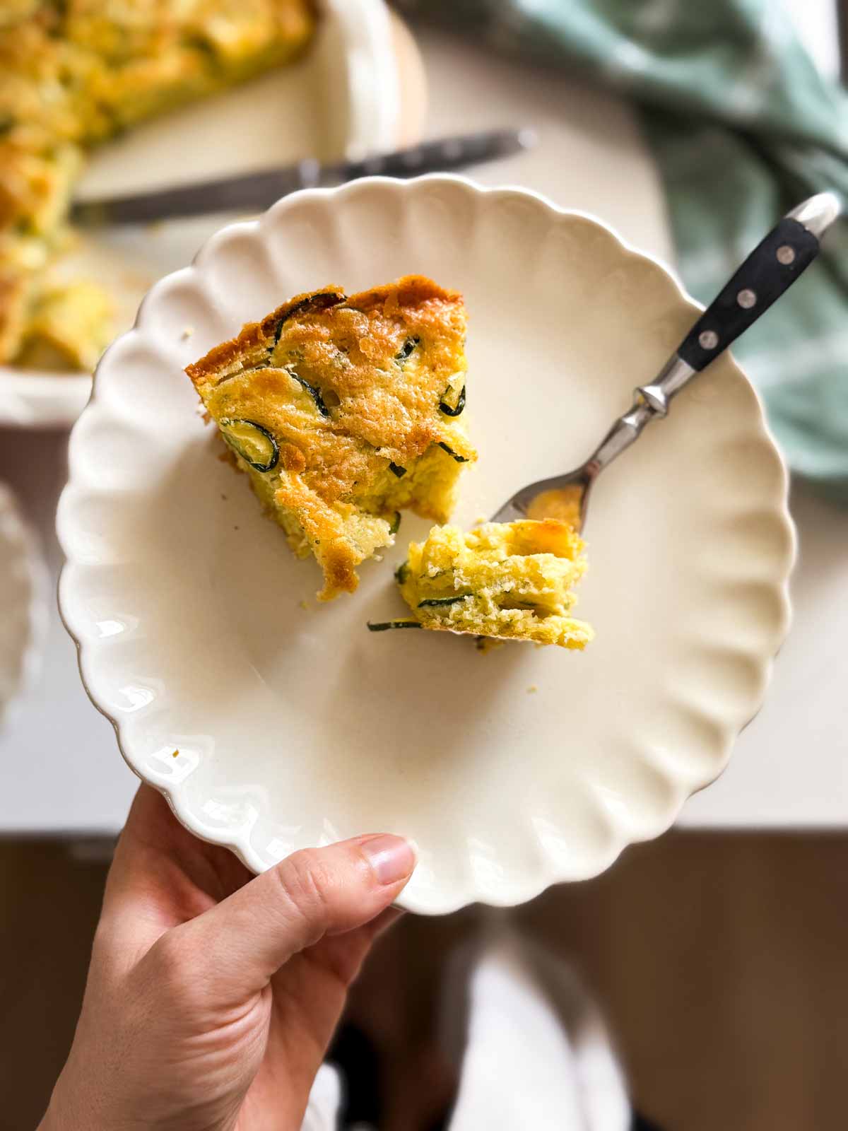 slice of zucchini pie being eaten