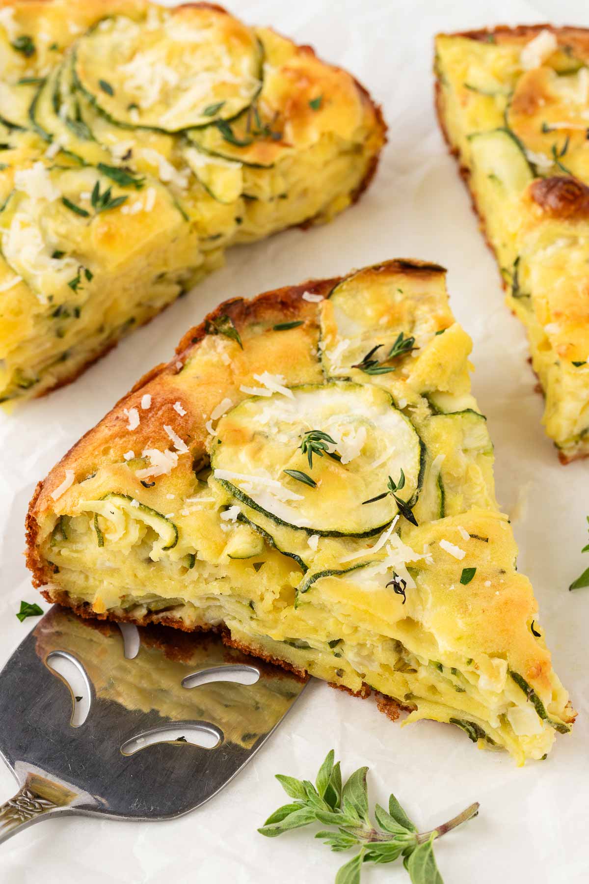 slices of zucchini pie on baking parchment