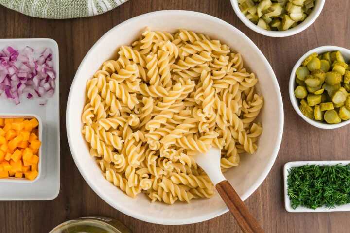 cooked pasta mixed with pickle juice