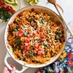 overhead view of Mexican chicken and rice in a skillet