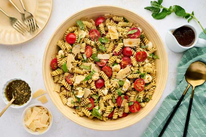 pesto caprese pasta salad being served