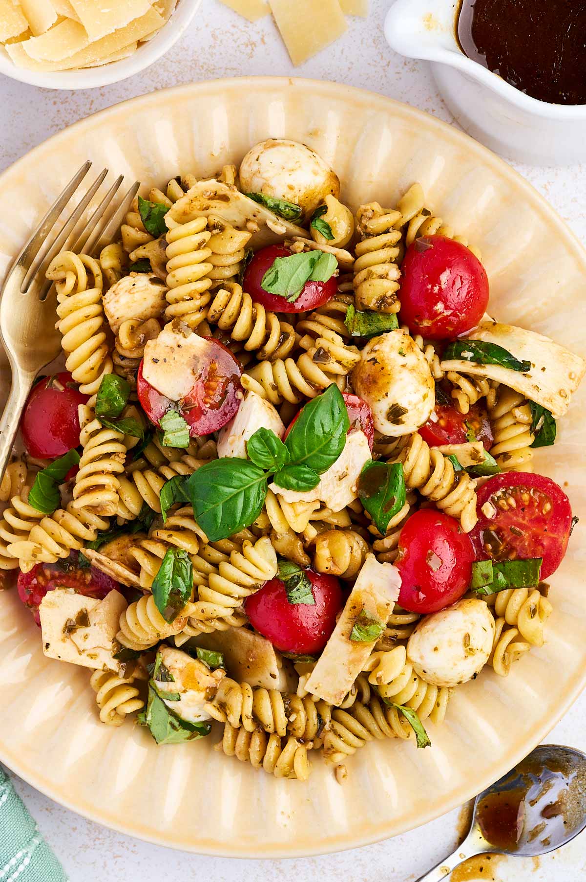 plate with caprese pasta salad on it