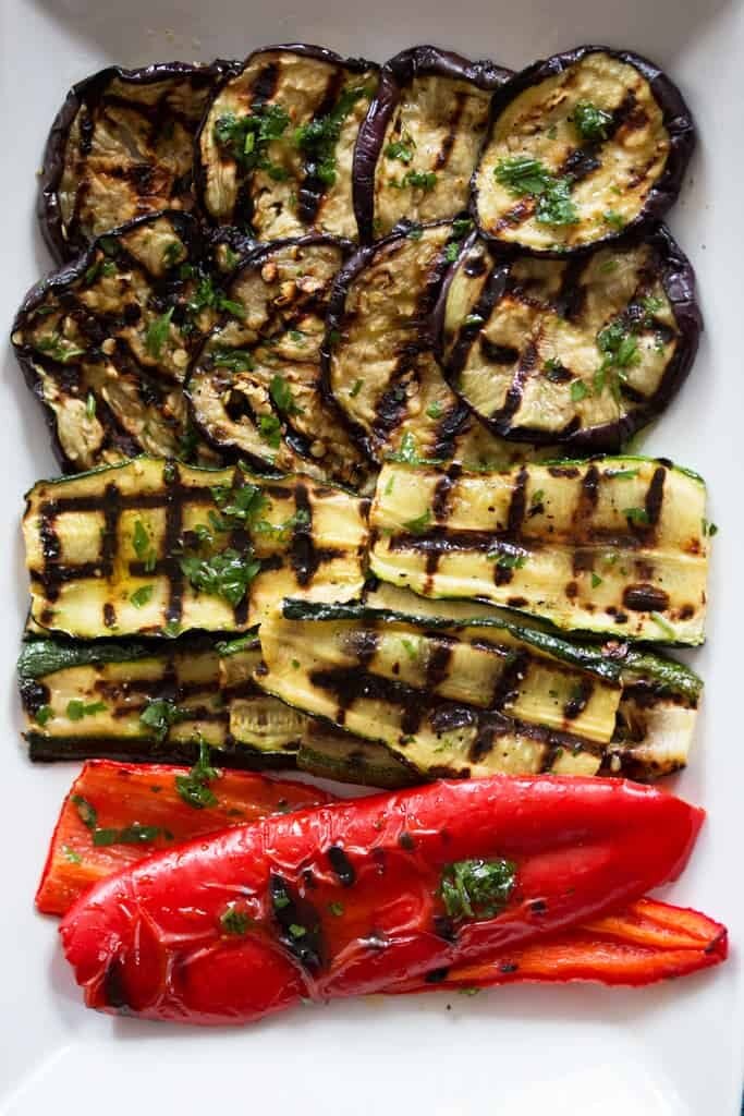 top down view on grilled vegetables on a white platter