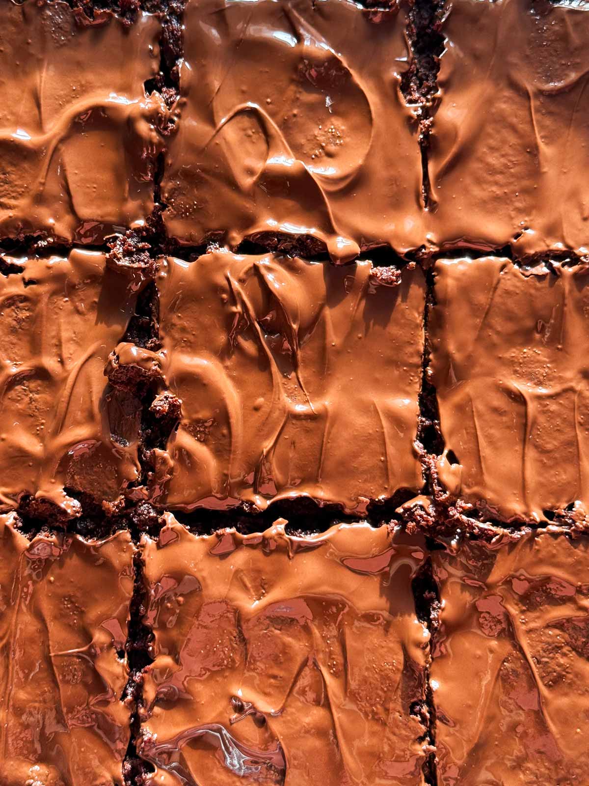 close up of ganache on brownies