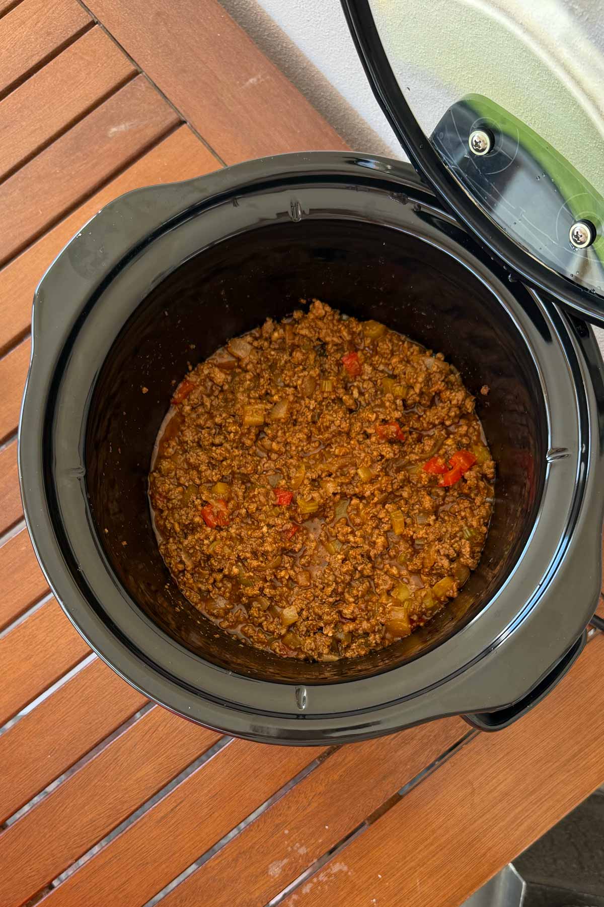 slow cooker on porch cooking sloppy joes