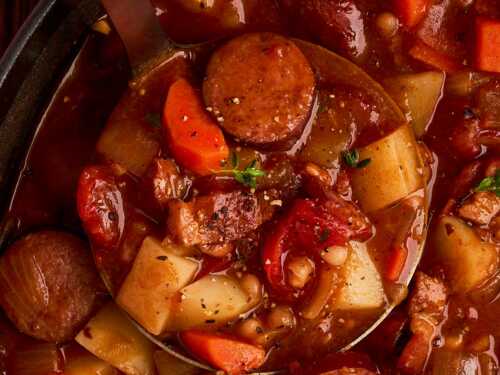 Scooping up bonfire stew.