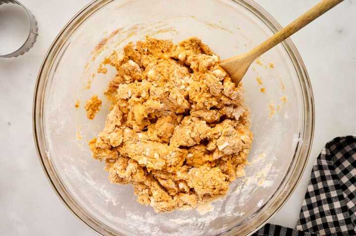 Mixing pumpkin biscuit dough.