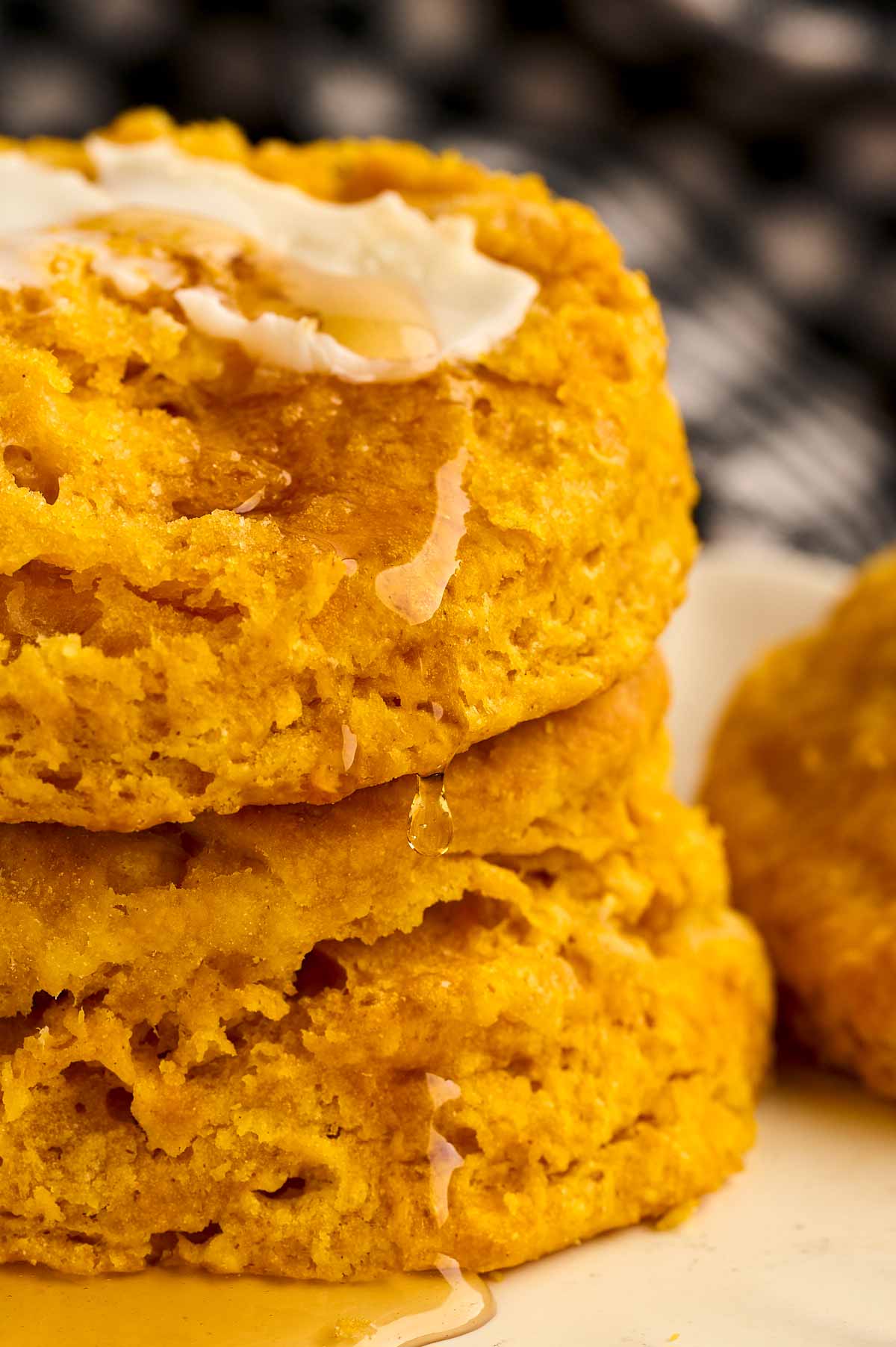 Yummy flaky pumpkin biscuits with butter and honey.