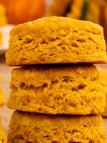 A stack of the flakiest pumpkin biscuits.