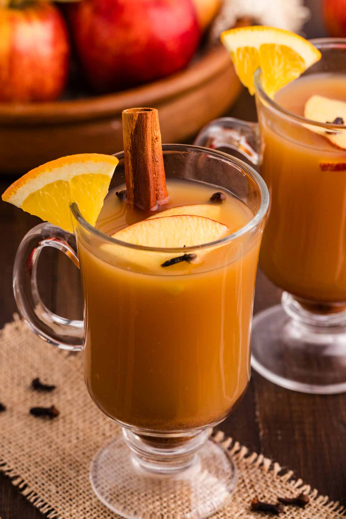 Enjoying hot apple cider in stemmed glassware.